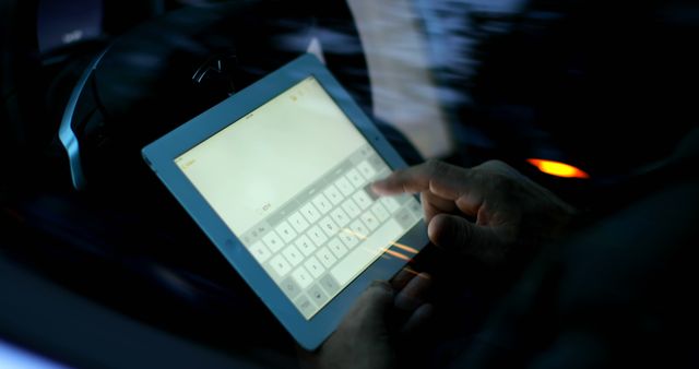 Person Using Tablet with Digital Keyboard in Dimly Lit Environment - Download Free Stock Images Pikwizard.com