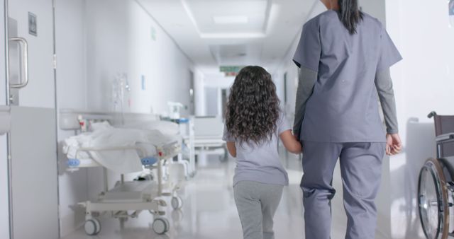 Nurse Guiding Child Through Hospital Hallway - Download Free Stock Images Pikwizard.com