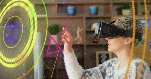 Woman interacting with virtual reality hologram at home