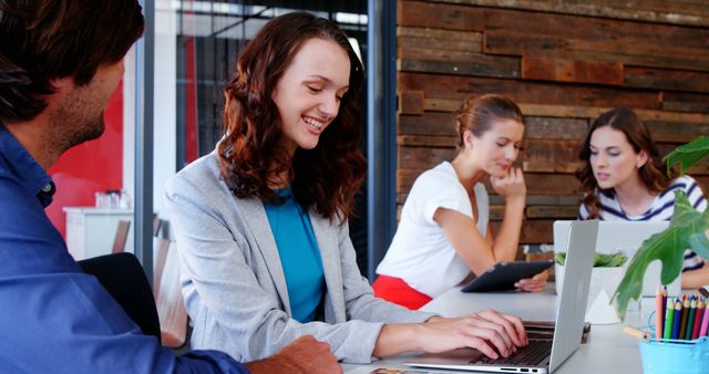 Smiling Team Collaborating During Work Meeting in Modern Office - Download Free Stock Images Pikwizard.com