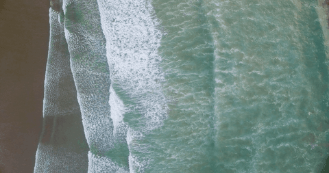 Transparent Waves Crashing on Sandy Beach from Aerial Perspective - Download Free Stock Videos Pikwizard.com
