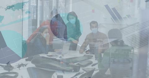 Team Analyzing Statistics in Modern Office with Digital Overlay