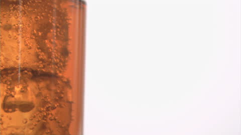 Refreshing Cola Bubbles Around Ice Cubes Slow Motion