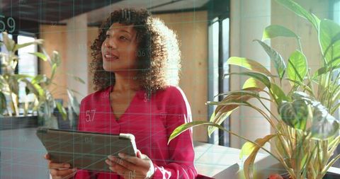 Modern Office with Female Professional and Greenery for Inspiration