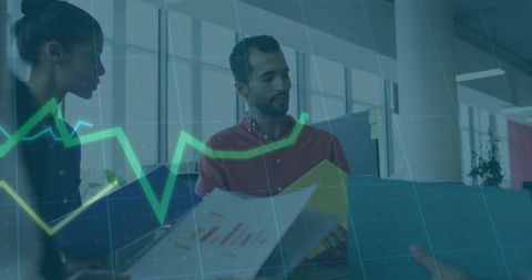 Business team analyzing data dashboards in modern open-plan office with overlay graphs
