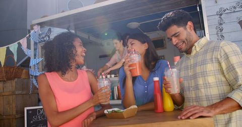 Young Adults Enjoying Refreshments at Food Truck Gathering - Download Free Stock Images Pikwizard.com
