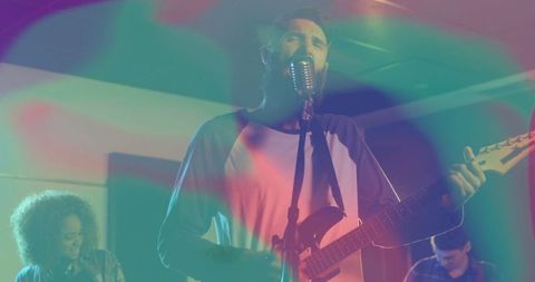 Vocalist and Guitarist Energizing the Stage with Vibrant Lights