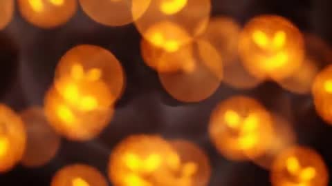 Halloween-Themed Pumpkin Orbs Floating in Dark Space
