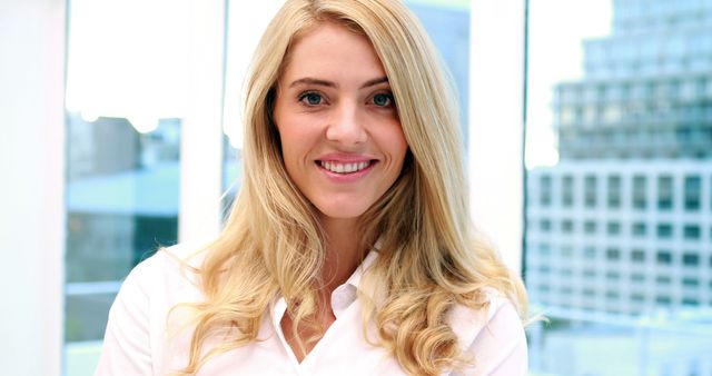 Blonde Woman Smiling Confidently in Modern Office - Download Free Stock Images Pikwizard.com