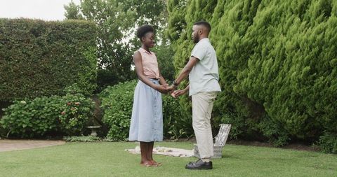 Fostering Romance: Couple Cherishing Moments in Lush Garden Embrace
