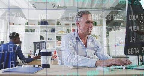 Business Professionals Analyzing Financial Data on Computers