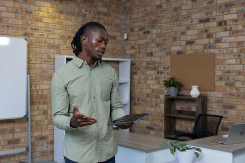 Focused Professional Presenting Digital Ideas in Modern Office Space