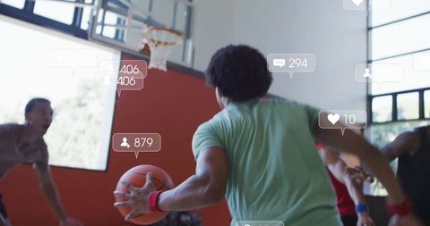 Players Engaged in Intense Indoor Basketball Match with Social Media Interaction
