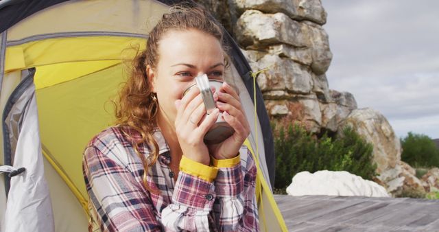 Woman Enjoying Hot Drink at Campsite Near Rock Formation - Download Free Stock Images Pikwizard.com