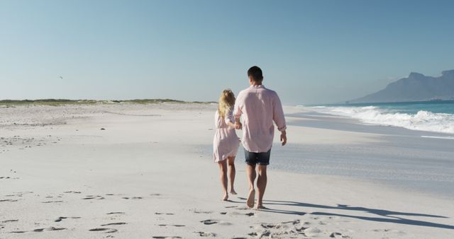 Couple Walking on Secluded Beach with Clear Blue Sky - Download Free Stock Images Pikwizard.com