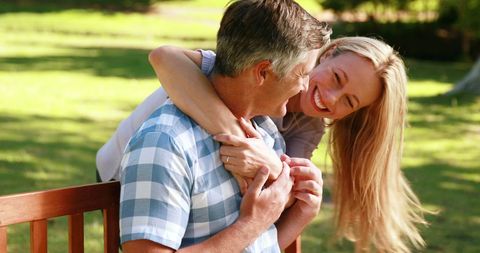 Couple Embracing on Park Bench Radiating Joy and Companionship - Download Free Stock Images Pikwizard.com