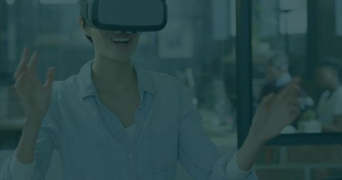 Young Professional Exploring Virtual Reality in Modern Office