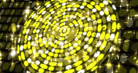 Glowing confetti falling over energetic yellow discs