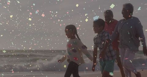 Family Walking on Beach at Sunset with Colorful Confetti Overlay