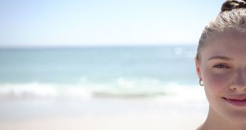 Serene Young Woman Enjoying Tranquil Beach Moments - Download Free Stock Images Pikwizard.com