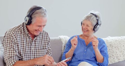 Joyful Senior Couple Enjoying Music Together at Home - Download Free Stock Images Pikwizard.com