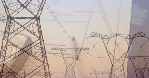 High-voltage transmission towers overlaying energy analytics on smartphone screen at dusk