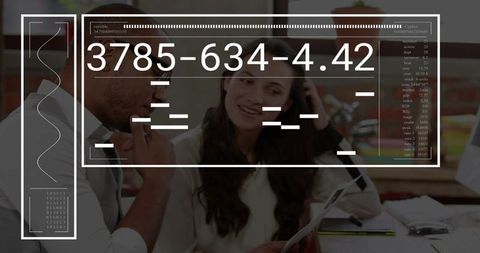 Coworkers reviewing documents with hud overlay collaborating and brainstorming