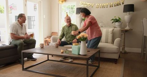 Happy Seniors Enjoying Birthday Celebration at Home