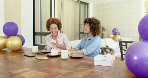 Midlife Friends Celebrating Birthday at Home with Cake, Balloons and Gift