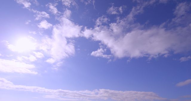 Panoramic shot of bright blue sky with clouds