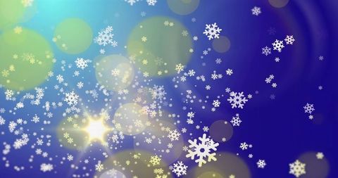 Drifting white snowflakes with bokeh light flares on blue violet gradient background