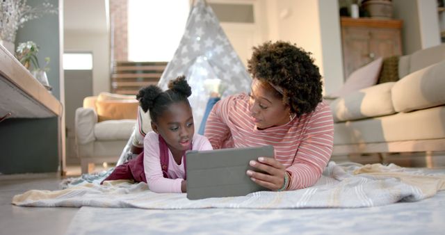 Mother and Daughter Bonding Over Tablet in Cozy Home - Download Free Stock Images Pikwizard.com