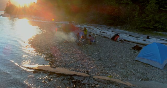 Camping By Lake At Sunset With Smoky Campfire And Tents - Download Free Stock Images Pikwizard.com