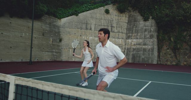 Mixed Doubles Tennis Match on Outdoor Court - Download Free Stock Images Pikwizard.com