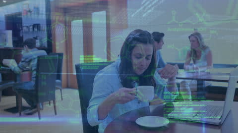 Woman in Café with Data Overlay on Laptop Taking A Coffee Break