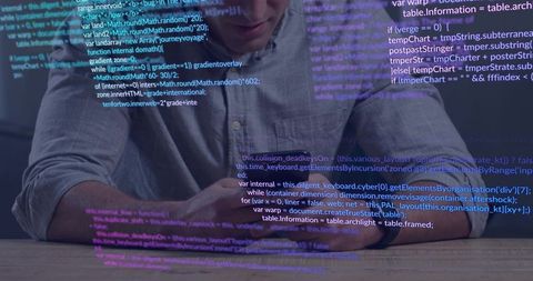 Developer checking smartphone under neon code overlay at wooden desk for app development