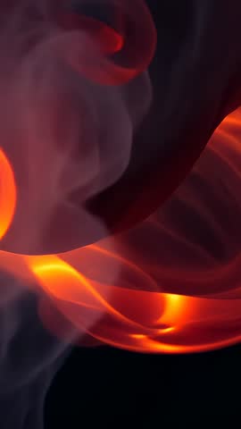 Macro vertical video glowing embers swirling through red smoke, flowing ember coils