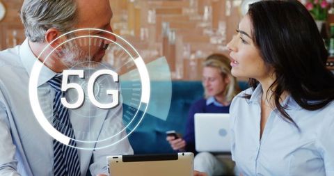 Diverse Business Discussion with 5G Technology Overlay