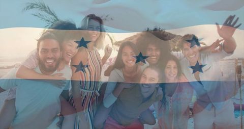 Group of Friends Laughing on Beach at Sunset Under Straw Palapa