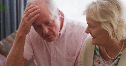 Senior Couple at Home with Laptop During Pandemic