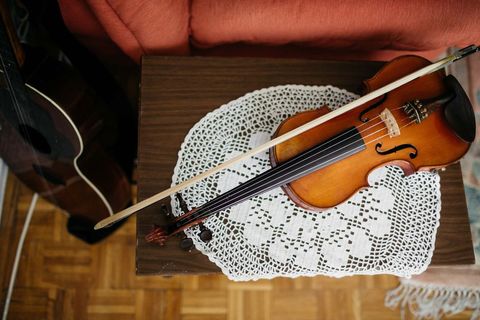 Classic Violin Resting on Handmade Lace Cover