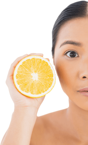 Half face asian woman with orange half facing camera on white