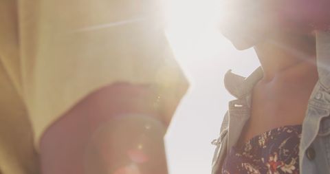 Beautiful Sunlit Moment with African American Couple on Beach