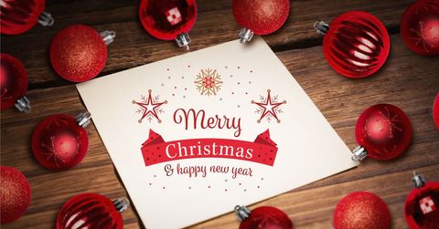 Festive christmas card with red holiday ornaments