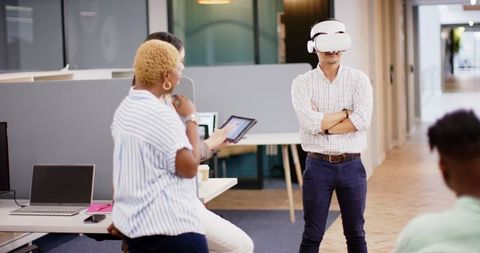 Professional Demonstrating Virtual Reality Headset in Modern Office Environment