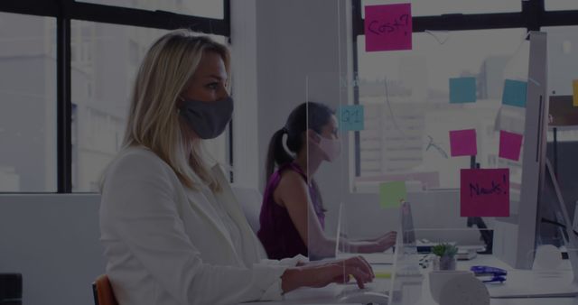 Businesswomen Wearing Masks Working in Modern Office with Safety Dividers - Download Free Stock Photos Pikwizard.com