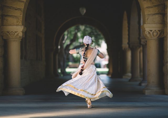 Woman in Traditional Indian Costume Dancing in Historic Courtyard - Download Free Stock Photos Pikwizard.com