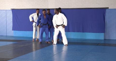Judo practice with african american men on tatami
