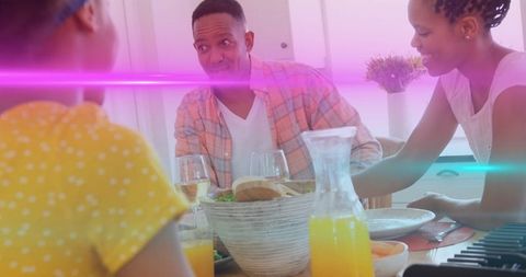 Joyful Family Sharing Breakfast in Vibrant Kitchen Space