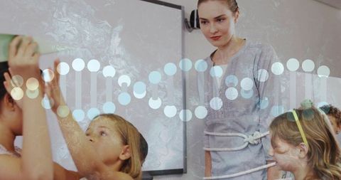 Diverse school students learn dna structure through interactive classroom activity